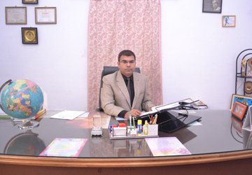 Professional science teacher with laboratory coat and confident expression